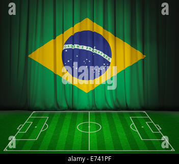 Soccer field with flag of Brazil on green curtain Stock Photo