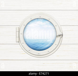 ship window or porthole on wooden wall with sea or ocean visible through it Stock Photo