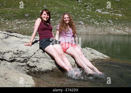 Two young women having fun at a lake Stock Photo