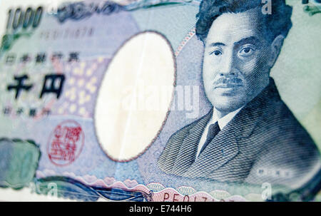 A one thousand Yen banknote from Japan photographed at an angle with the renowned bacteriologist Hideyo Noguchi on the front. Stock Photo
