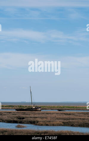 A single boat moored in the salt marsh at Leigh on Sea, Essex shot at high tide Stock Photo