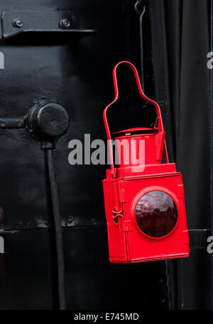 Red lamp on the rear of steam locomotive. Stock Photo