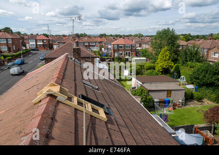 View from a roof top showing a home made roof step ladder and safety rope, Droylsden, Tameside, Manchester, England, UK Stock Photo