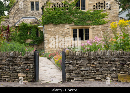 Michigan, Dearborn, Greenfield Village. Cotswold Cottage, traditional English limestone cottage, circa 1600's, from England. Stock Photo