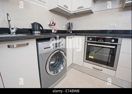 Closeup detail of kitchen area in luxury apartment show home Stock Photo