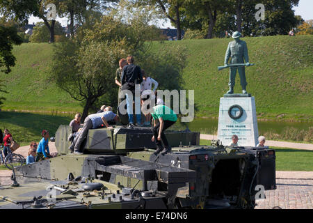 Copenhagen, Denmark. 6th September, 2014. Open House in celebration of the 400th anniversary of the Danish army.  A great number of present and former service personnel, veterans, families, curious Danes and tourists visit the comprehensive hands-on exhibitions, performances, and activities at  Kastellet (the Citadel) and the neighbouring Churchill Park. Getting close to, climbing into, touch, and ask questions about vintage and contemporary combat and special vehicles was a hit.  This is a contemporary combat vehicle of the CV-9035 type. Credit:  Niels Quist/Alamy Live News Stock Photo