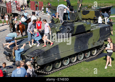 Copenhagen, Denmark. 6th September, 2014. Open House in celebration of the 400th anniversary of the Danish army.  A great number of present and former service personnel, veterans, families, curious Danes and tourists visit the comprehensive hands-on exhibitions, performances, and activities at  Kastellet (the Citadel) and the neighbouring Churchill Park. Getting close to, climbing into, touch, and ask questions about vintage and contemporary combat and special  vehicles was a hit. Here a combat vehicle of the CV-9035 type. Credit:  Niels Quist/Alamy Live News Stock Photo