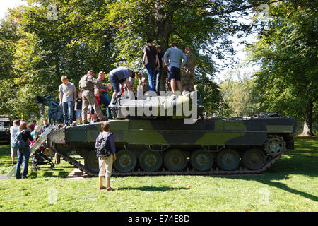 Copenhagen, Denmark. 6th September, 2014. Open House in celebration of the 400th anniversary of the Danish army.  A great number of present and former service personnel, veterans, families, curious Danes and tourists visit the comprehensive hands-on exhibitions, performances, and activities at  Kastellet (the Citadel) and the neighbouring Churchill Park. Getting close to, climbing into, touch, and ask questions about vintage and contemporary combat and special  vehicles  was a hit.This is a Leopard 2 A5 tank. Credit:  Niels Quist/Alamy Live News Stock Photo