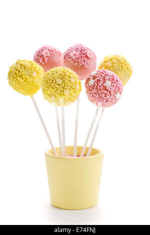 Pink and yellow cake pops isolated on white background. Party dessert Stock Photo