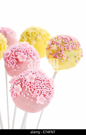 Pink and yellow cake pops isolated on white background. Party dessert Stock Photo