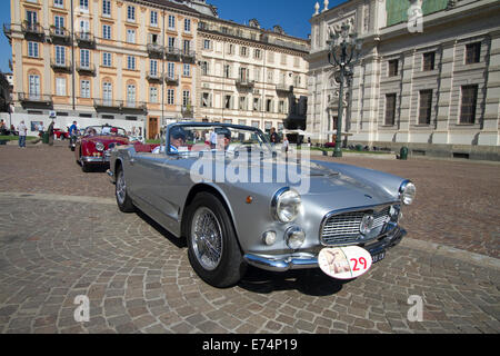 Torino, Italy. 6th September 2014. A 1962 3500 Spider Maserati arrives in Piazza Carlo Alberto, Torino. Collectors of historical cars met in Torino for a car elegance competition. Stock Photo