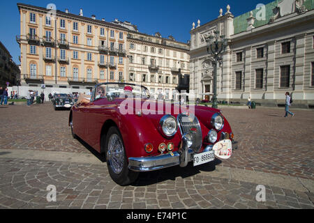 Torino, Italy. 6th September 2014.A 1958 Jaguar XK 150 DHC arrives in Piazza Carlo Alberto, Torino. Collectors of historical cars met in Torino for a car elegance competition. Stock Photo