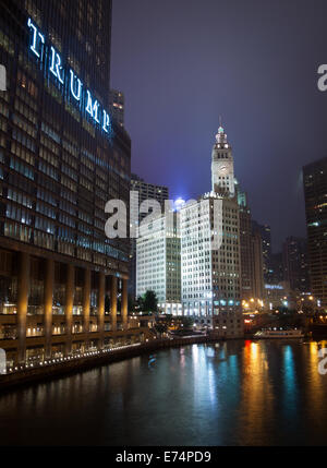 A view of the Wrigley Building, Trump International Hotel and Tower Chicago, and the Chicago River at night.  Chicago, Illinois. Stock Photo