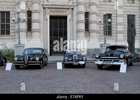 Torino, Italy. 6th September 2014. Three 1940's cars on exhibition. From left to right: Alfa Romeo 6c 2500 SS, Lancia Aprilia Cabriolet and Cadillac Coupe De Ville. Collectors of historical cars met in Torino for a car elegance competition. Stock Photo