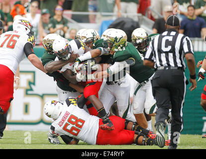 City, Florida, US. 6th Sep, 2014.Maryland Terrapins running back Wes Brown (4) is stop by the South Florida Bulls defense during the third quarter at Raymond James Stadium in Tampa on Saturday, September 6, 2014. Maryland defeated South Florida 24 to 17. Credit:  Octavio Jones/Tampa Bay Times/ZUMA Wire/Alamy Live News Stock Photo