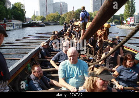 Berlin, Germany. 6th Sep, 2014. An original replica of a Viking boat, 'Sea Stallion from Glendalough' rowed by people accompanied by river police near Oberbaum Bridge going to Berlin for a Vikings exhibition at Martin-Gropiusbau that will start on September 9, 2014. Credit:  Simone Kuhlmey/Pacific Press/Alamy Live News Stock Photo
