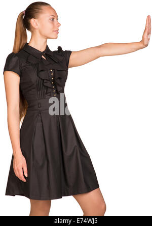 Isolated young casual woman push imaginary wall Stock Photo