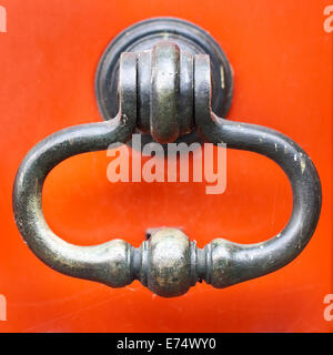 Antique door handle / knocker on the front door of a house in Ghent, Belgium Stock Photo