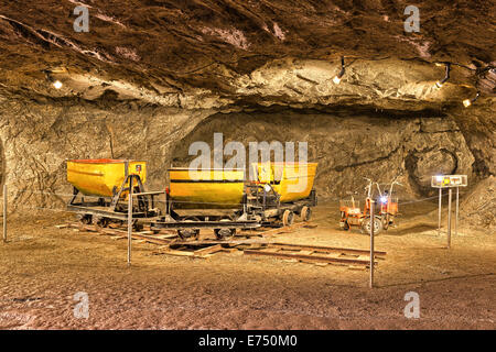 Visitor tour through the salt mine in Bex showing a a few wagons that were used to transport salt out of the mines  The salt dep Stock Photo