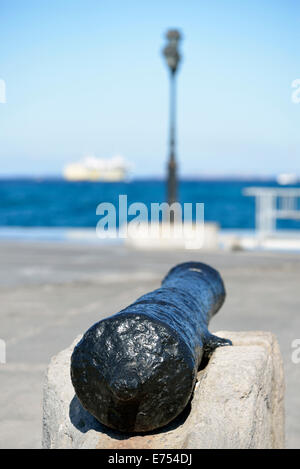 Old cannon in Aegina port, Aegina island, Greece Stock Photo