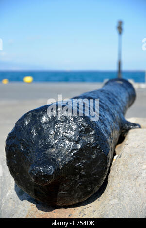 Old cannon in Aegina port, Aegina island, Greece Stock Photo