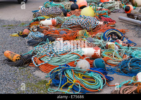 Fishing ropes and equipment during the day on the floor Stock Photo