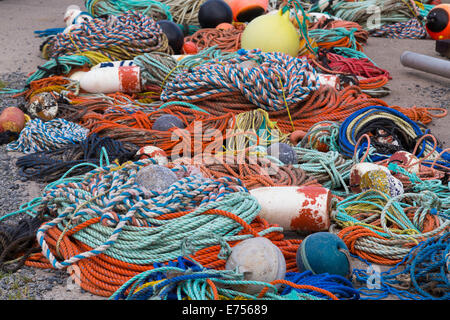 Fishing ropes and equipment during the day on the floor Stock Photo