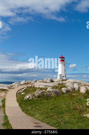 Peggy's Cove Lighthouse during the day with a path leading up towards it Stock Photo