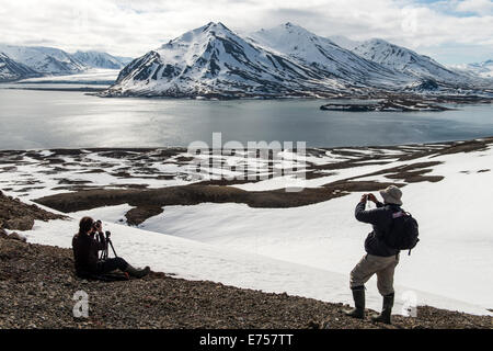Tourists taking pictures at Recherfjorden Svalbard Norway Arctic Circle Scandinavia Europe Stock Photo