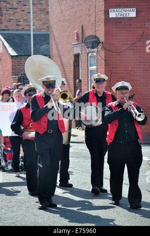 Gorton, Manchester, UK. 7th Sep, 2014. Gorton Carnival Parade on way to Debdale Park, with a stop on Tesco car park, Gorton, for several of the groups in the parade to perform for spectators. Credit:  Krisken/Alamy Live News Stock Photo