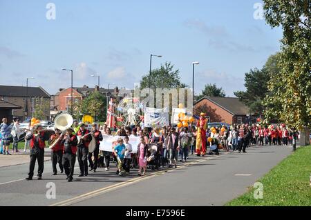Gorton, Manchester, UK. 7th Sep, 2014. Gorton Carnival Parade on way to Debdale Park, with a stop on Tesco car park, Gorton, for several of the groups in the parade to perform for spectators. Credit:  Krisken/Alamy Live News Stock Photo