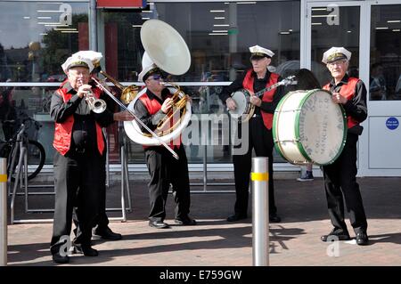 Gorton, Manchester, UK. 7th Sep, 2014. Gorton Carnival Parade on way to Debdale Park, with a stop on Tesco car park, Gorton, for several of the groups in the parade to perform for spectators.-The parade leading musicians play for the spectators Stock Photo