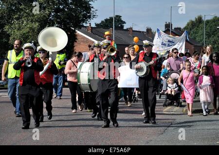 Gorton, Manchester, UK. 7th Sep, 2014. Gorton Carnival Parade on way to Debdale Park, with a stop on Tesco car park, Gorton, for several of the groups in the parade to perform for spectators.-Musicians leading the parade toward Debdale Park Stock Photo