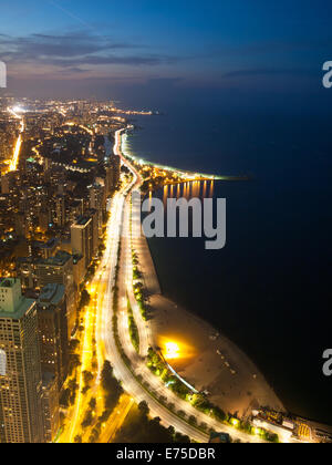 A night, aerial view of North Lake Shore Drive, Oak Street Beach, North Avenue Beach, Lake Michigan and the Gold Coast. Chicago. Stock Photo