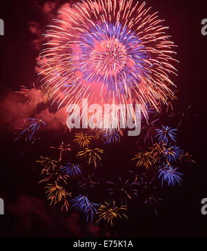 Brightly colorful fireworks in the night sky Stock Photo