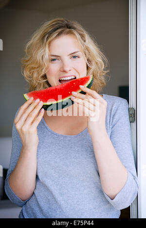 Woman eating fruit Stock Photo