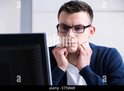 Young man working on a computer Stock Photo