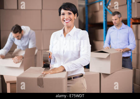 Warehouse workers packing up boxes Stock Photo