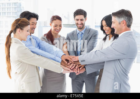 Business team stacking their hands Stock Photo