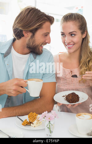 Happy couple enjoying coffee and cake Stock Photo