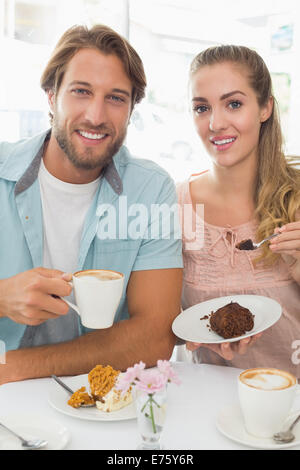 Happy couple enjoying coffee and cake Stock Photo