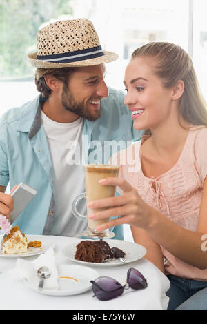 Happy couple enjoying coffee and cake Stock Photo