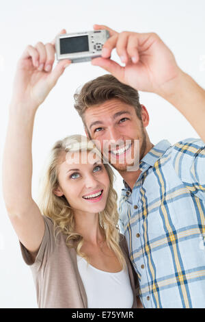 attractive young couple taking a selfie Stock Photo - Alamy