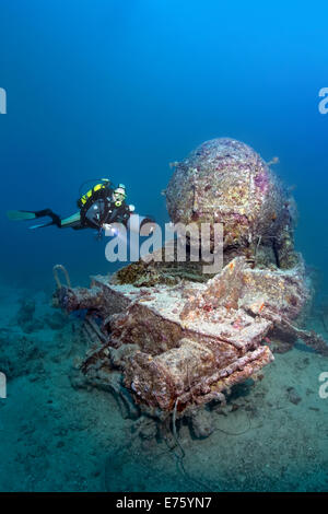 Scuba diver at the remains of a Stanier 8F locomotive, shipwreck of the SS Thistlegorm, Red Sea, Shaab Ali, Sinai Peninsula Stock Photo