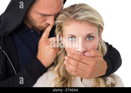 Theft covering young woman's mouth Stock Photo
