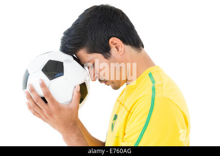 Side view of a tensed football player Stock Photo