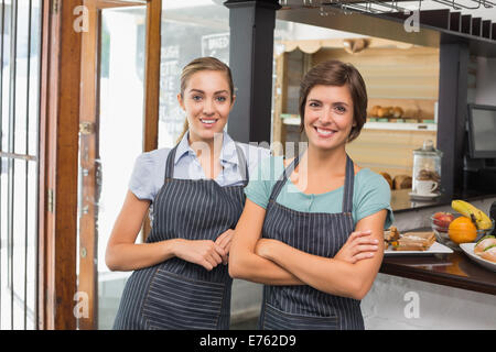 Pretty waitresses smiling at camera Stock Photo