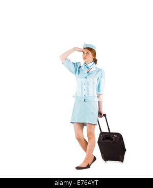 Pretty air hostess pulling suitcase Stock Photo