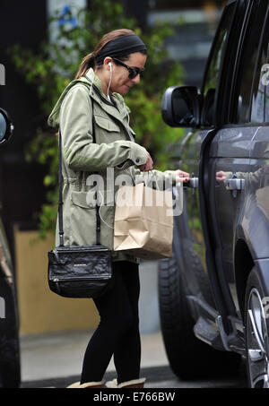 Lea Michele returns to her car after shopping at Earthbar in West