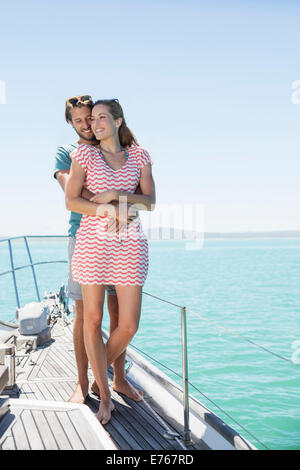 Couple standing on boat together Stock Photo